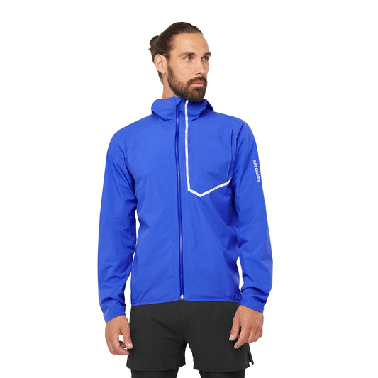 Man wearing a blue jacket with a brand logo on a white background