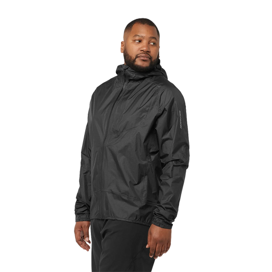 Man wearing a black rain jacket on a white background