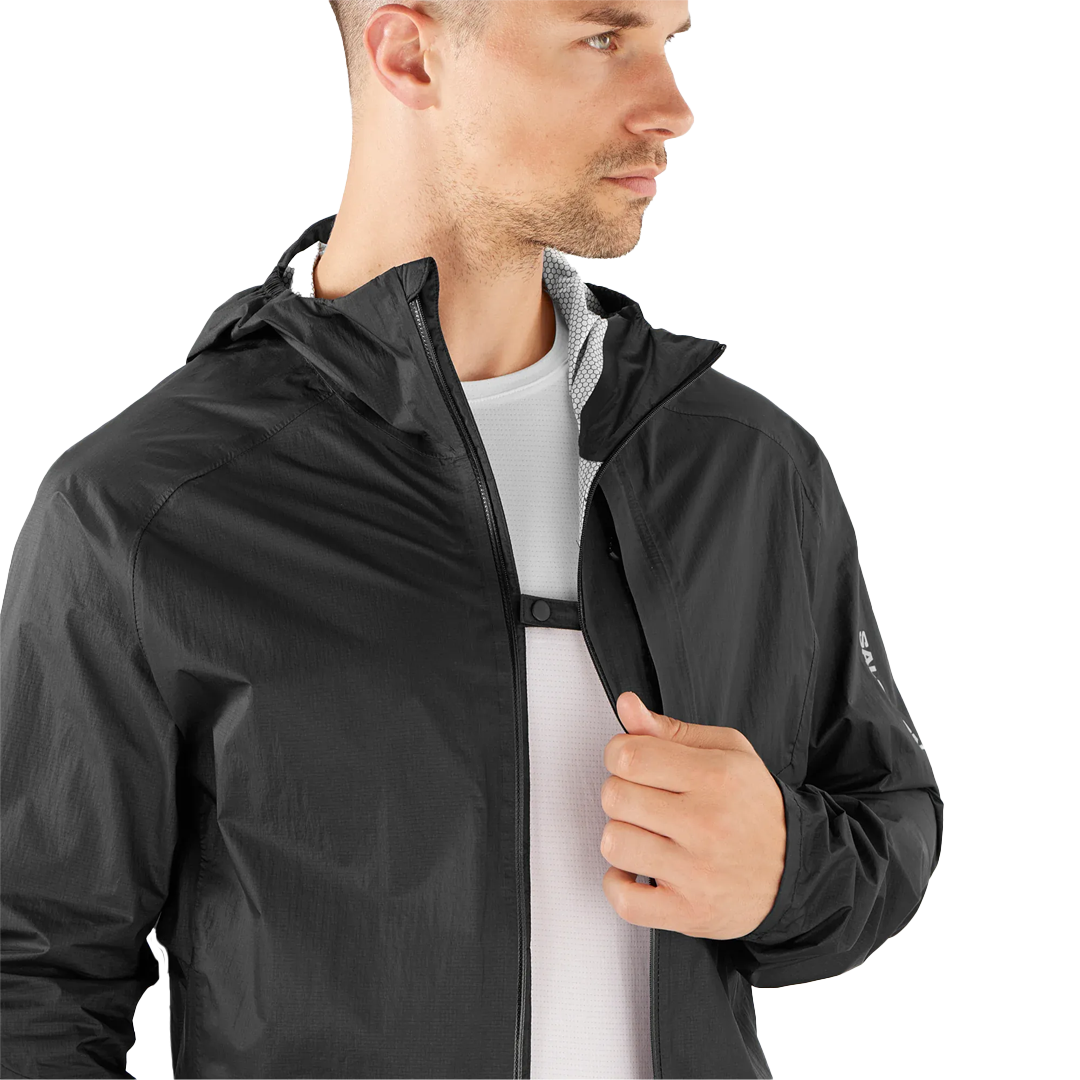 Man wearing a black jacket on a white background