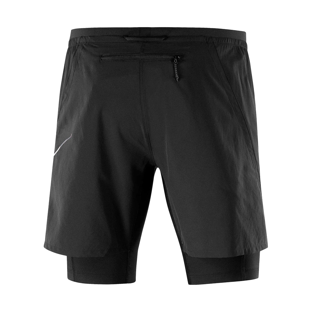 Black shorts with a small logo on a white background