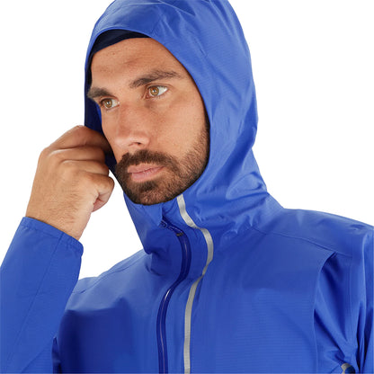 Man wearing a blue raincoat with a white background
