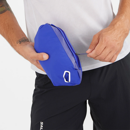 Person holding a blue pouch with a white background