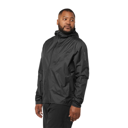 Man wearing a black rain jacket on a white background