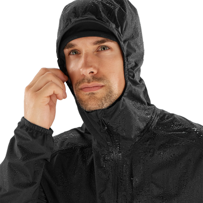 Man wearing a black raincoat on a white background