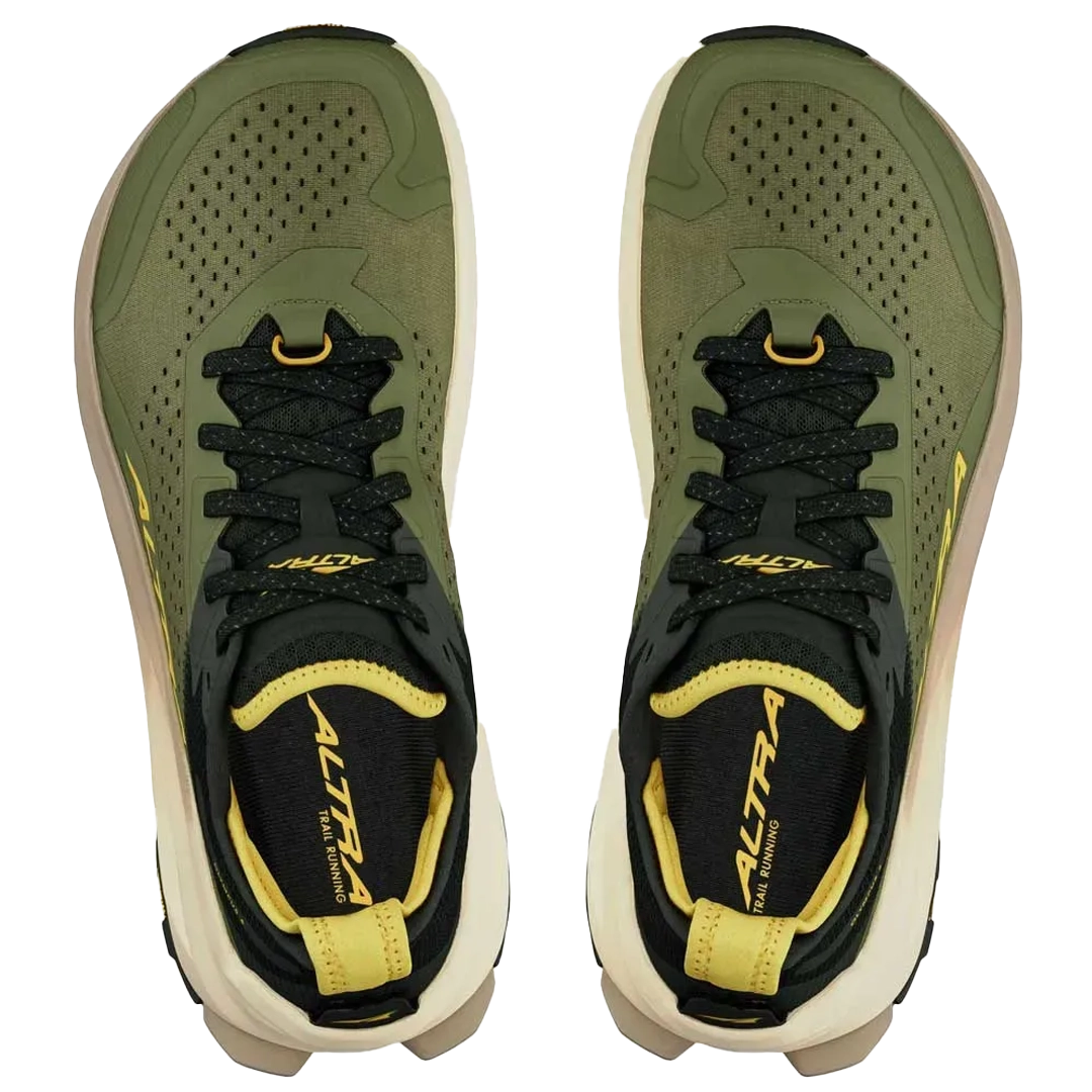 Green and black running shoes with yellow accents on a white background