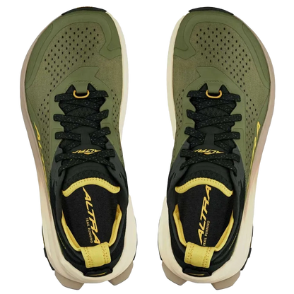 Green and black running shoes with yellow accents on a white background