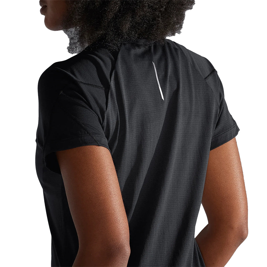 Person wearing a black athletic shirt with a white logo on a white background